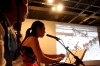 Jung Ji-eun plays her Kayageum composition while her father's photos are projected onto the screen